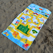 Play mat travel beach towel for kids. Kids swim towel with a play mat design on it. Beach town picture with roads for toy cars. It's a beach toy and a towel!